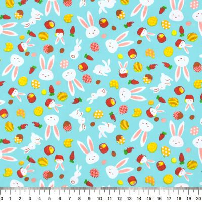 Tecido-tricoline-pascoa-coelhos-e-ovos-fundo-azul-10191.